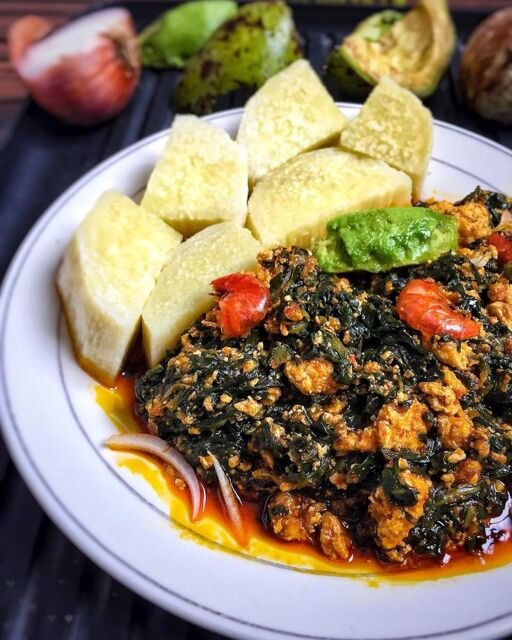 palava sauce  with yam slices and meat