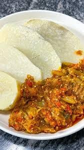 yam slices with garden eggs sauce and fish image